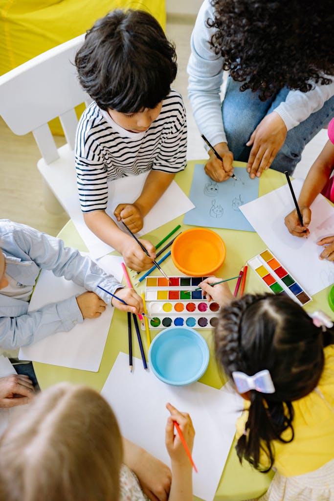 Children Painting With Water Colors