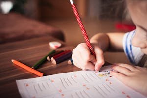 Close-up of Girl Writing